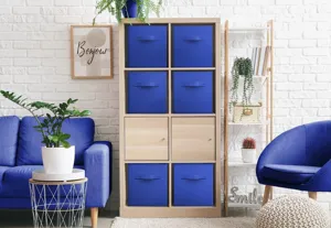 Detail view of blue folding fabric storage box, open-top square cube container for closet organization.
