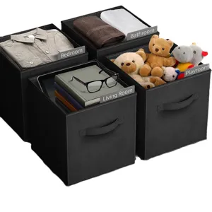 Foldable black fabric storage bins with label holders for home organization and closet storage.