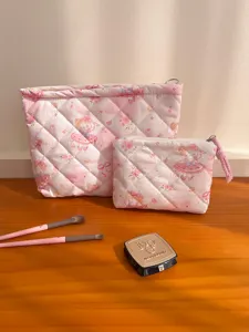Cute pink quilted makeup bag set with cartoon print, small and large cosmetic pouches.