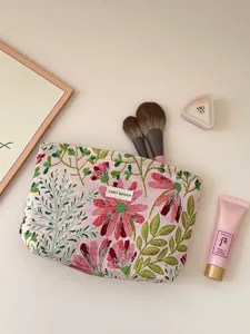 Pink floral embroidered cosmetic bag, cute portable makeup pouch for women and travel.