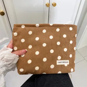 Corduroy makeup pouch with brown polka dots, retro cosmetic storage bag for travel and daily use.