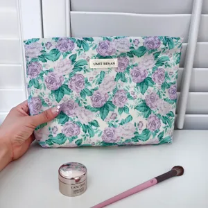 Floral cotton cosmetic pouch with zipper, elegant purple rose pattern for daily travel and makeup storage.