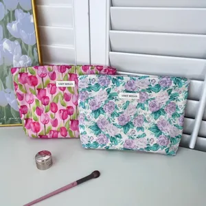 Floral cotton makeup bag with zipper, portable cosmetic pouch for travel and daily use.