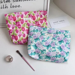 Floral cotton makeup bag with zipper closure, portable cosmetic pouch and toiletry organizer.