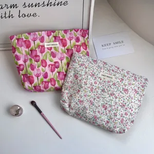 Floral cotton cosmetic bag portable makeup pouch with zipper and floral print design.