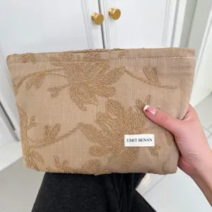 Vintage cotton linen embroidered makeup bag, chic floral clutch purse for women daily storage.