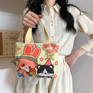 Cute mini canvas handbag with adorable cartoon print, versatile casual daily tote bag.