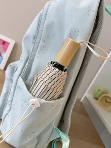 Mochila escolar bonita azul claro con estrellas y paraguas de rayas espaciosa