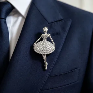 Close-up detail of a sparkling rhinestone ballerina brooch pinned elegantly on a suit jacket.