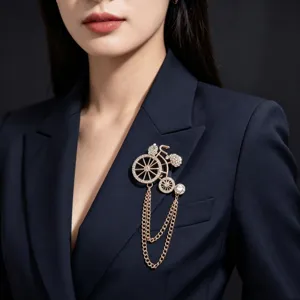Elegant rhinestone bicycle brooch with tassel chain, perfect for chic blazer accessories.