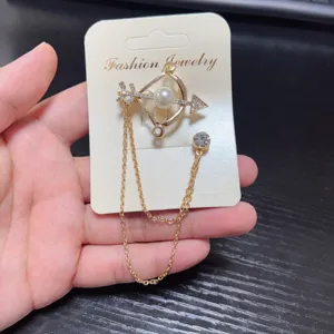 Elegant bow arrow brooch with pearl rhinestones and tassel chain for women suit jacket.