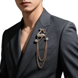 Elegant rose gold rhinestone deer brooch with dual chains worn on a grey suit jacket main view.