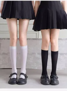 Detail shot of Japanese JK style calf socks in black and white, paired with shoes.