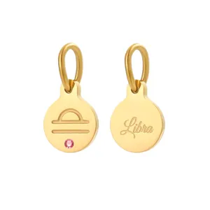 Stainless steel 14K gold plated Libra zodiac sign round pendant charm accessory with pink zircon stone.