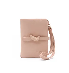 Women's short wallet with leaf decoration, pink PU leather folding purse with strap.
