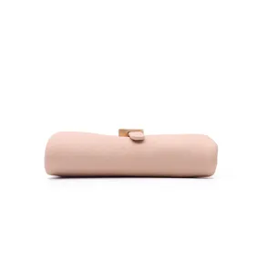 Minimalist pink leather short wallet detail, compact folding coin purse with metal buckle.