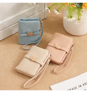 Women short wallet PU leather mini folding purse with leaf buckle zipper wrist strap.
