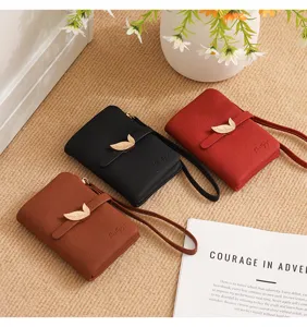Simple women's short wallet PU leather folding coin purse with leaf buckle and wrist strap.