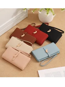 Elegant long women wallet with unique leaf metal clasp, multi-card slots and wrist strap design.