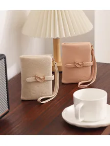 Women's short leather wallet with leaf clasp and wrist strap, minimalist daily folding purse.