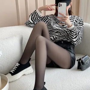Collants noirs translucides doublés polaire pour femmes, bas thermiques effet jambes nues.