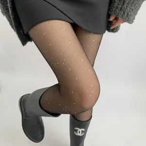 Sheer black tights detail with glittering silver stars and shimmering translucent fabric finish.