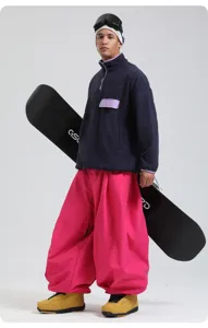 Waterproof windproof loose wide leg snow pants for outdoor winter sports and skiing adventures.