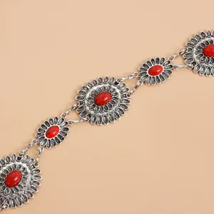 Antique silver alloy waist chain detail with oval red stone floral medallions.