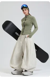 Professional women's loose wide leg waterproof windproof snowboard ski pants for winter outdoor sports.