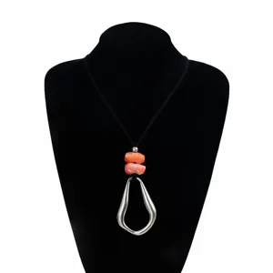 Geometric irregular pendant necklace with black cord and stylish fashion jewelry style.