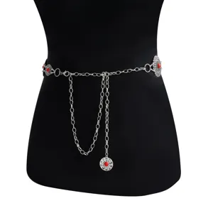 Close up of vintage silver waist chain details with red stone flower pendant charm design