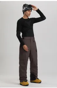 Detailed view of waterproof cargo ski pants with multiple functional pockets for winter sports.