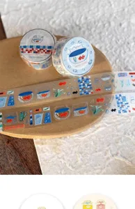 Washi tape detail showing cute summer goldfish and fish tank patterns with glitter effect.