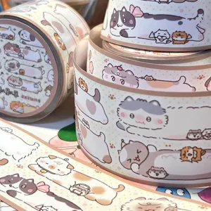 Cute cat washi tape rolls detail shot, decorative masking sticker tape for journaling and DIY crafts.