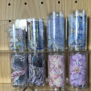 Clear tape storage tubes with decorative washi tape loops displayed neatly for journaling.