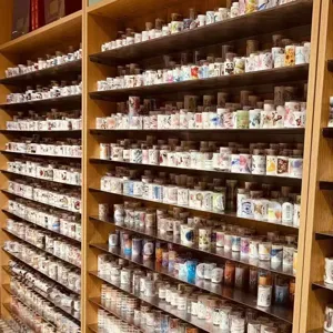Clear plastic storage tubes for washi tape, decorative masking tape organizer and display container.