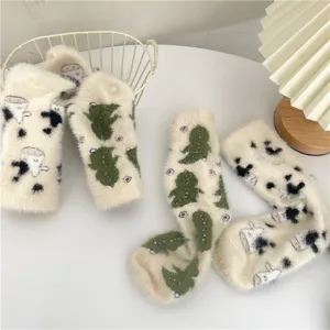 Cute plush fuzzy socks for women, thick warm winter sleep socks with sweet cartoon animal prints.