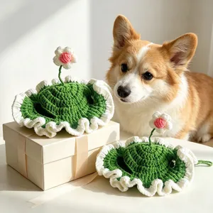 Handmade crochet pet hat with cute flower design, cozy green and white cat dog cap.