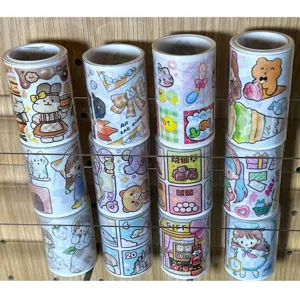 Clear washi tape storage tubes and dispenser set, transparent cylindrical packaging case.