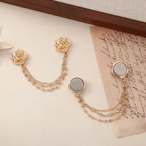 Gold rose magnetic clothing clips with rhinestone chains for pants waist adjustment and fixing.