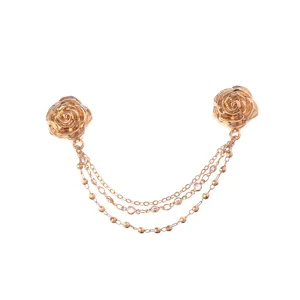 Detailed view of the golden rose magnetic trouser cinching clip with multi-strand chains.