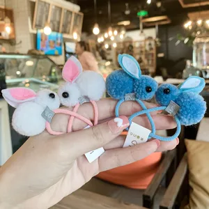 Close-up of cute plush bunny hair ties with soft ears, perfect for kids daily hair styling.