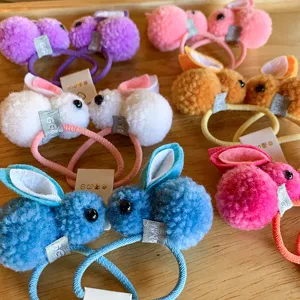 Cute plush rabbit hair ties for kids, soft pompom hair ropes and colorful rubber bands.
