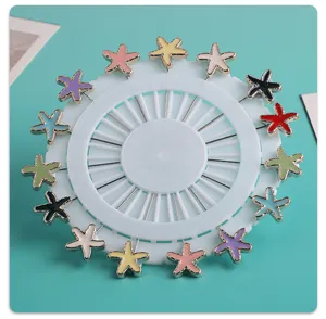 Colorful resin starfish brooch pins set on a white round display holder, perfect clothing accessory.