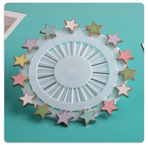 Colorful star resin long pins brooch set displayed on a clean white round wheel holder.