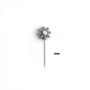 Grey resin flower lapel pin with pink center and long needle, cute clothing accessory.
