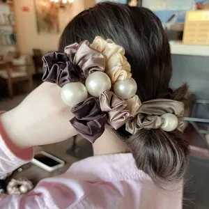 Satin hair scrunchie with large pearl detail, elegant hair tie for ponytail and bun styling