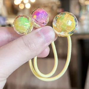 Colorful disco ball hair tie for kids, crystal dual-ball elastic hair rope detail view.