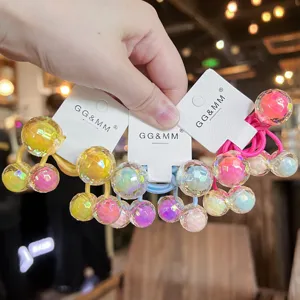 Colorful disco ball hair ties detail closeup, cute double ball kids hair accessories elastic.