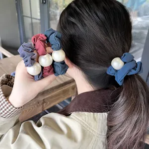 Detail pearl hair scrunchies, elegant elastic ponytail holder accessory for daily wear style.